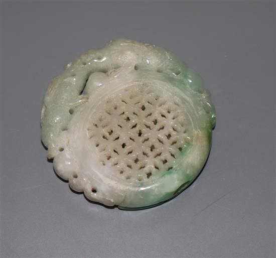 A carved jade plaque, diameter 5cm